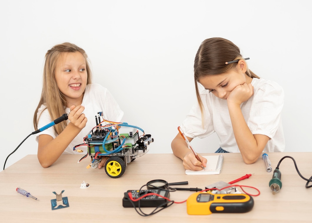Kids building robots and coding at a fun robotics camp